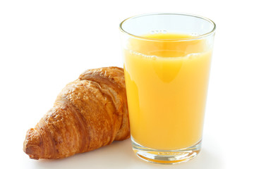 Single glass of orange juice with a croissant
