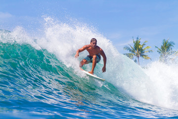 Surfing a Wave. Bali Island. Indonesia. - obrazy, fototapety, plakaty