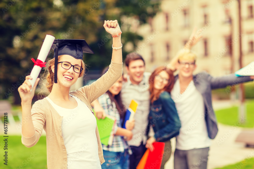 Poster smiling teenage girl in corner-cap with diploma