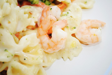 Close-Up of Creamy Garlic Sauce with Shrimp and Veggies