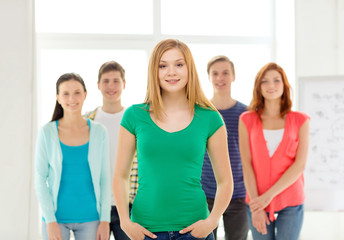 smiling students with teenage girl in front