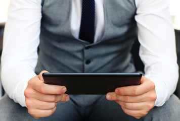 Young adult working on a digital tablet