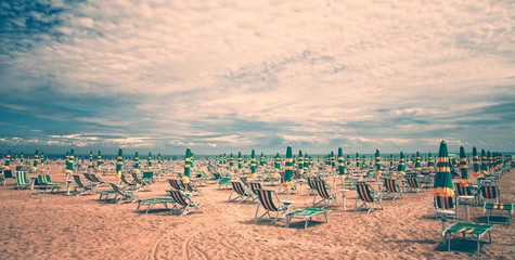 Vintage beach with deckchairs