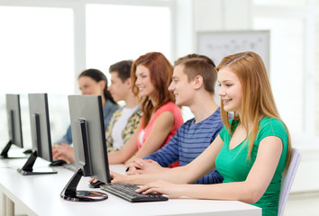 female student with classmates in computer class
