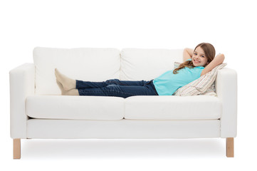 Obraz premium smiling little girl lying on sofa