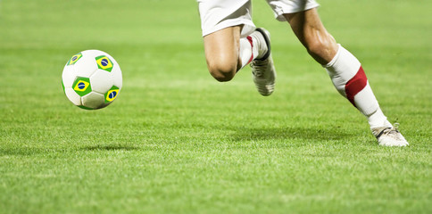 Obraz premium Soccer player's ball with Brazil flag