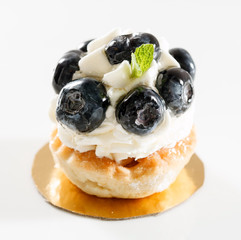 Blueberry tart on white background