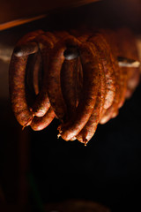 Traditional food. Smoked sausuages in smokehouse.