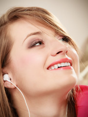 Girl with white headphones listening to music
