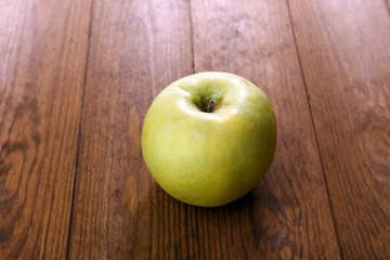 Apple on wooden background