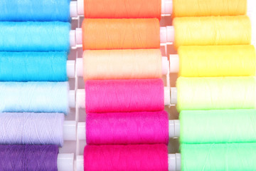Multicolor sewing threads background