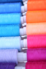 Multicolor sewing threads background