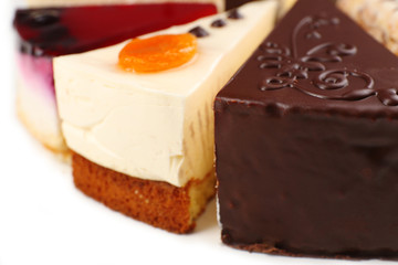 Assortment of pieces of cake, isolated on white © Africa Studio