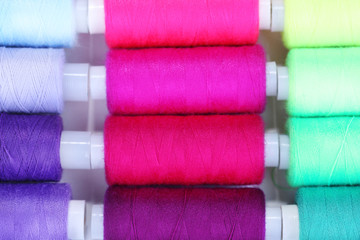 Multicolor sewing threads background