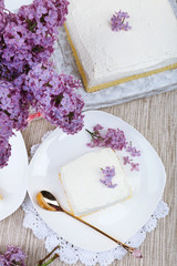 Delicious dessert with lilac flowers