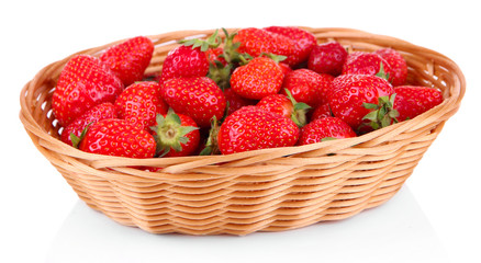 Ripe sweet strawberries in wicker basket, isolated on white