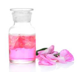 Obraz na płótnie Canvas Rose oil in bottle isolated on white