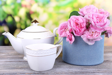 Breakfast tea with  teapot of fresh pink garden roses