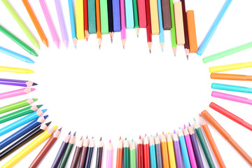Frame with colorful crayons and  chalk pastels, isolated