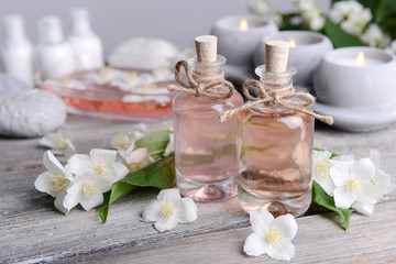 Obraz na płótnie Canvas Spa composition with jasmine flowers on table close-up