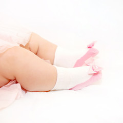 Tiny baby feet in pink shoes