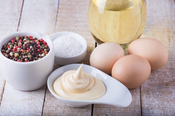 Mayonnaise in bowl on table