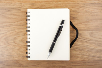 Recycled paper notebook with black elastic band and pen
