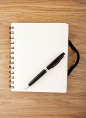 Recycled paper notebook with black elastic band and pen