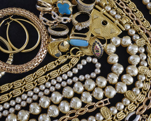 pirate's gold, variety of precious jewelry closeup