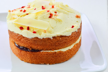 Obraz na płótnie Canvas White chocolate jam and cream sponge cake