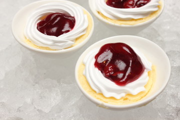 mini cherry cheese cake in white cup