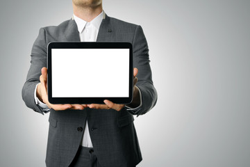 businessman showing blank digital tablet