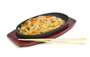 Udon noodles with vegetables isolated on white background