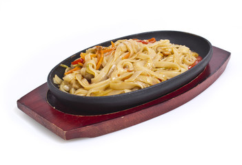 Udon noodles with vegetables isolated on white background