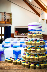Wedding cake on stage background of reception hall