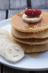 Stack of delicious pancakes with fresh fruits