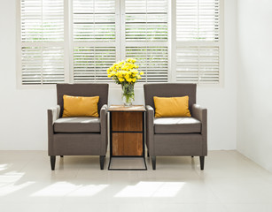 Grey sofa armchair in simple setting