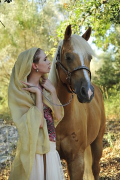 Young lady with horse