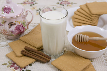 glass of milk and cookies on a beautiful cloths