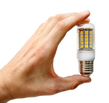 led lightbulb in the hand isolated on white