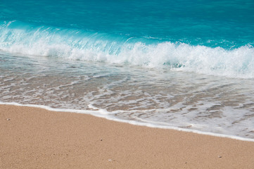 Fototapeta na wymiar Seashore, waves and sandy beach