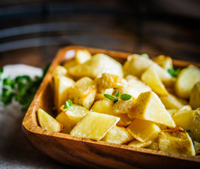 Baked potatoes on wooden background