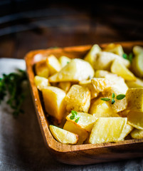 Baked potatoes on wooden background