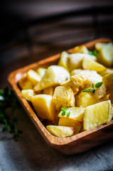 Baked potatoes on wooden background