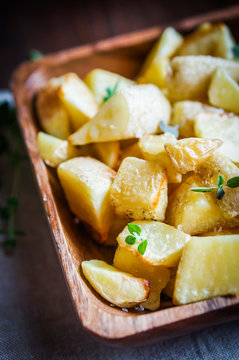 Baked potatoes on wooden background