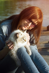 Young woman and Siberian cat