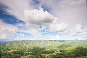 Fototapeta na wymiar landscape with mountain trees hill and blue sky