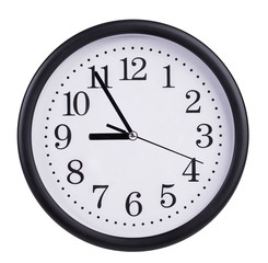 Round wall clock shows five to nine