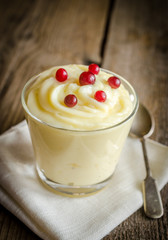 Classic custard on the wooden background