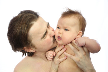 Daddy kissing newborn baby